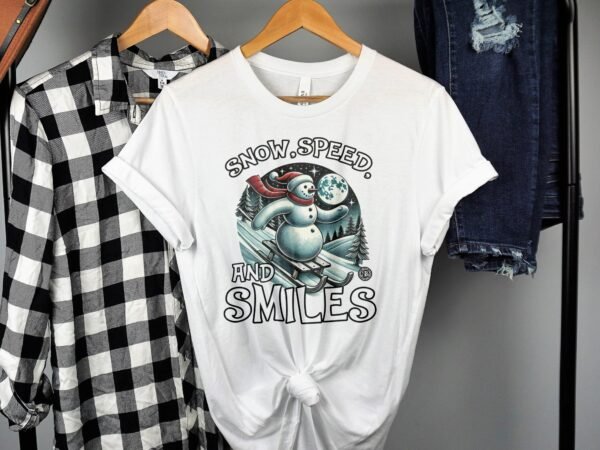 Snow Speed and Smiles T Shirt Vintage Snowman Sledding Graphic Tee Winter Holiday Gift Funny Snowman Shirt Outdoorsy - Image 2